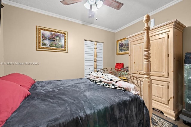 bedroom featuring ceiling fan and ornamental molding