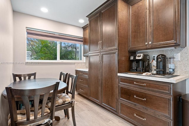 dining room with recessed lighting and light wood-style flooring