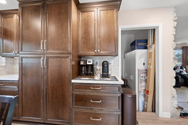 kitchen featuring decorative backsplash and light countertops