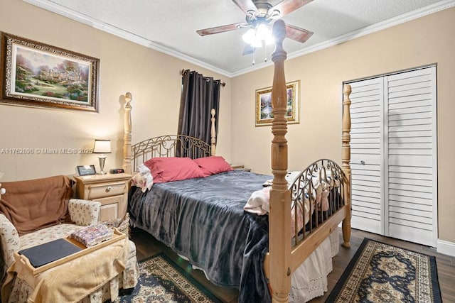 bedroom with crown molding, ceiling fan, wood finished floors, a closet, and a textured ceiling