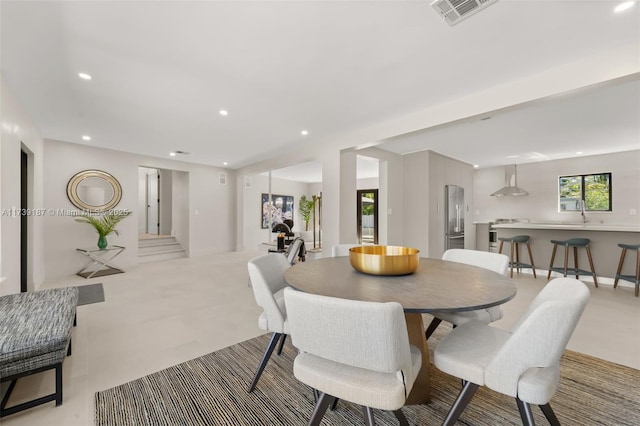 dining room with recessed lighting, visible vents, and stairway