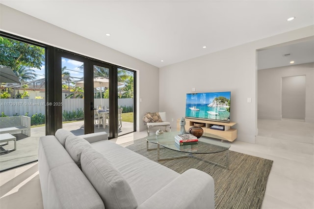 living area featuring recessed lighting and french doors