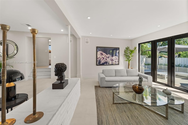 living room featuring visible vents and recessed lighting