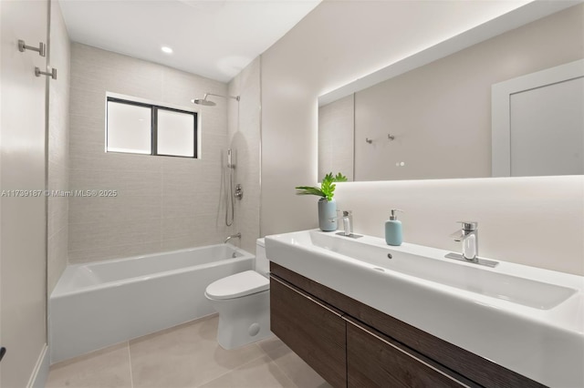 full bath with tile patterned flooring, toilet, vanity, and shower / bath combination