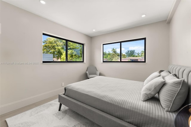 bedroom featuring recessed lighting, baseboards, and wood finished floors