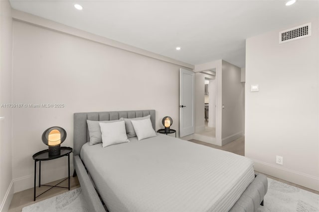 bedroom with recessed lighting, visible vents, and baseboards