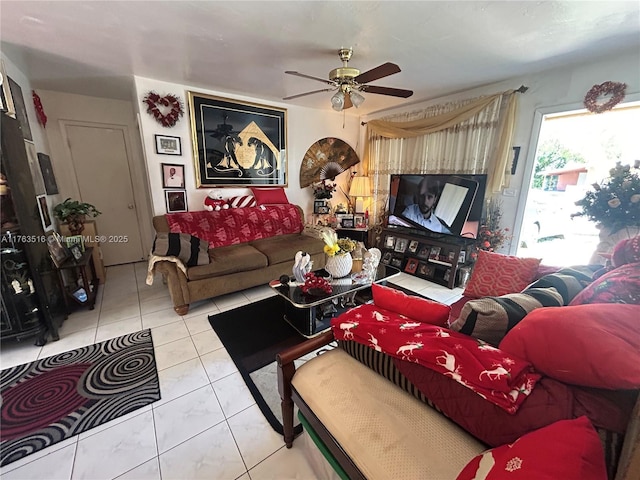 living room featuring tile patterned floors and a ceiling fan