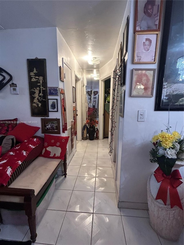 hallway featuring light tile patterned floors