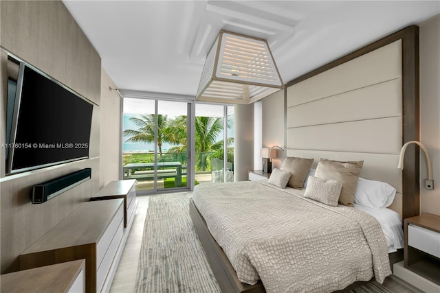 321 Ocean Dr Unit 200, Miami Beach, FL 33139 - bedroom featuring access to outside and a wall of windows