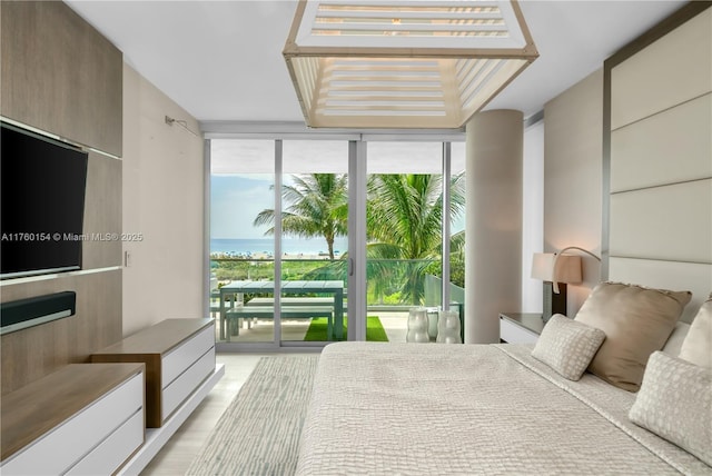 321 Ocean Dr Unit 200, Miami Beach, FL 33139 - bedroom with floor to ceiling windows, a water view, and access to outside