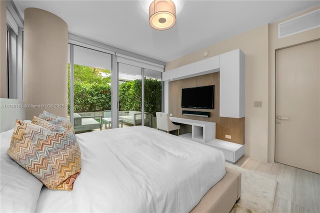 321 Ocean Dr Unit 200, Miami Beach, FL 33139 - bedroom featuring a wall of windows, visible vents, and access to outside