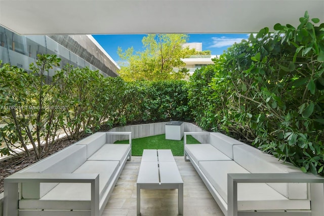 view of patio with outdoor lounge area and fence