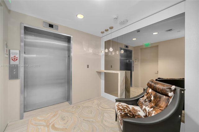 bathroom featuring wood finished floors, elevator, recessed lighting, and visible vents