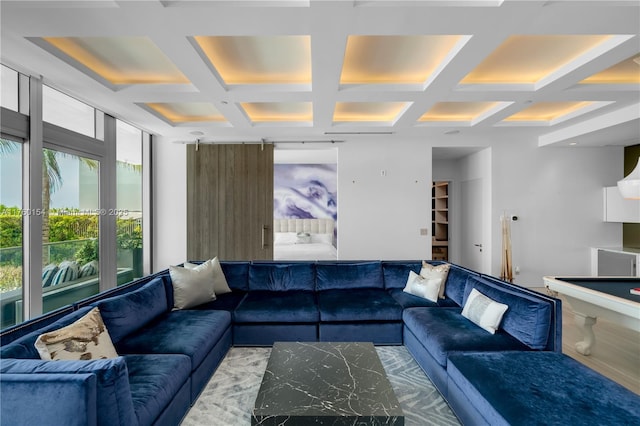 living room featuring beamed ceiling and coffered ceiling