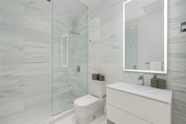321 Ocean Dr Unit 200, Miami Beach, FL 33139 - full bath with tile walls, walk in shower, vanity, and toilet
