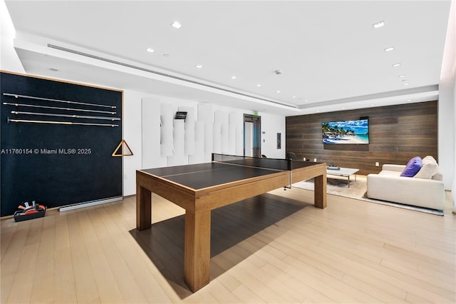 321 Ocean Dr Unit 200, Miami Beach, FL 33139 - recreation room featuring recessed lighting, wooden walls, and wood finished floors