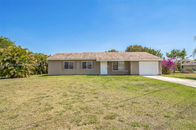 single story home featuring stucco siding, an attached garage, concrete driveway, and a front yard