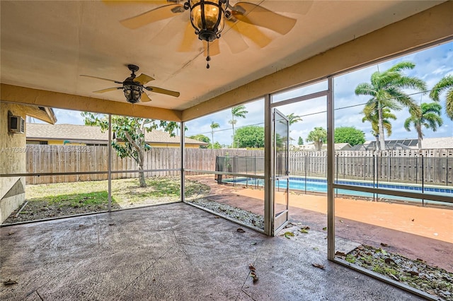 1281 Wyndcliff Dr, Wellington, FL 33414 - unfurnished sunroom featuring plenty of natural light and a ceiling fan