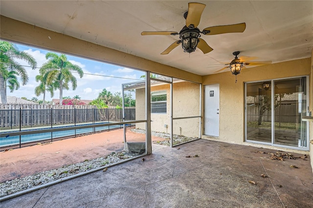 1281 Wyndcliff Dr, Wellington, FL 33414 - view of patio featuring a fenced in pool, ceiling fan, and fence
