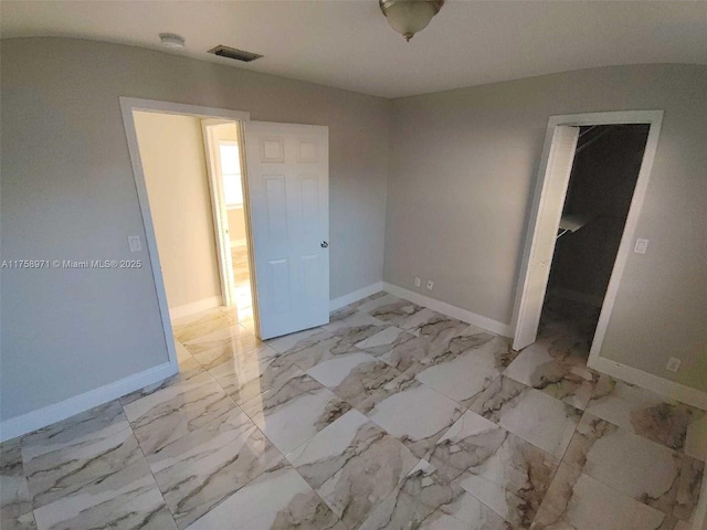 unfurnished bedroom featuring visible vents, marble finish floor, and baseboards