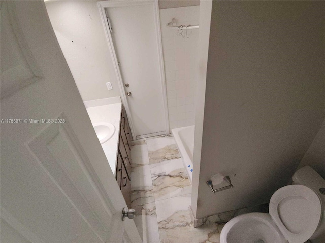 full bath with marble finish floor, vanity, and toilet