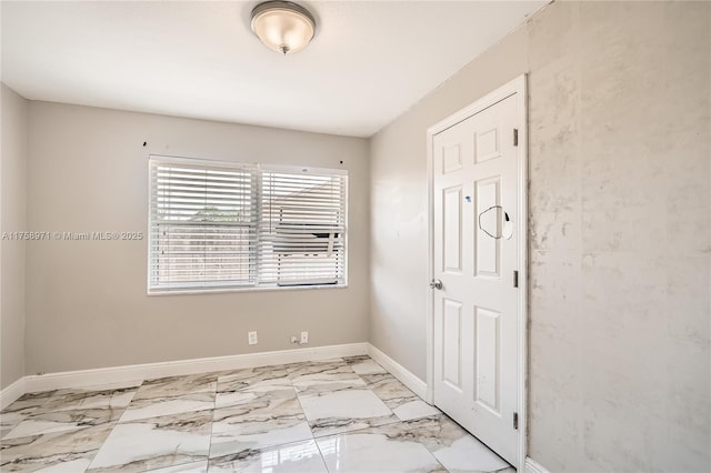 1281 Wyndcliff Dr, Wellington, FL 33414 - spare room featuring baseboards and marble finish floor
