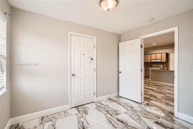 1281 Wyndcliff Dr, Wellington, FL 33414 - unfurnished bedroom featuring baseboards and marble finish floor