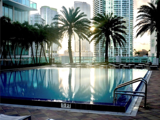 view of pool featuring a view of city