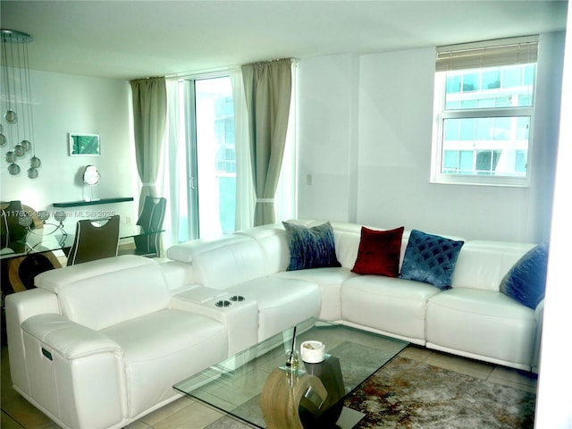 living room featuring tile patterned flooring and plenty of natural light