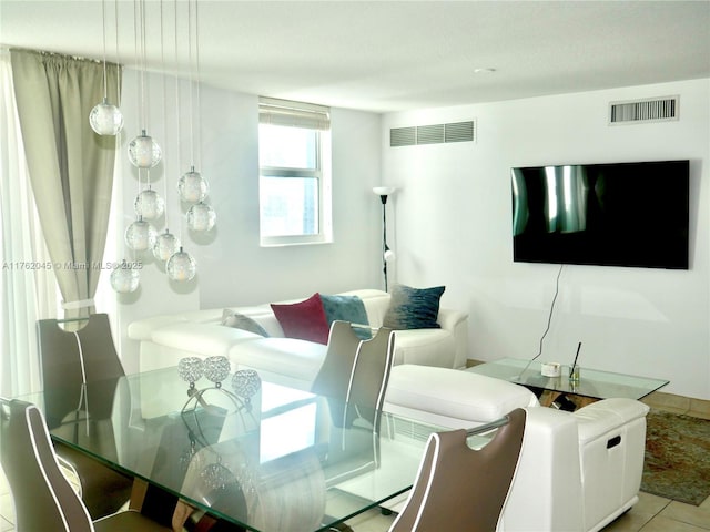 dining area with light tile patterned flooring and visible vents