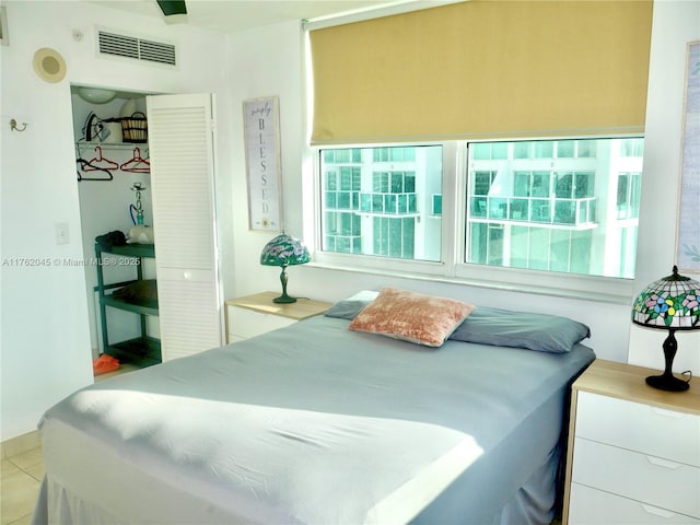 bedroom featuring tile patterned flooring and visible vents