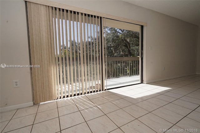 tiled spare room with baseboards