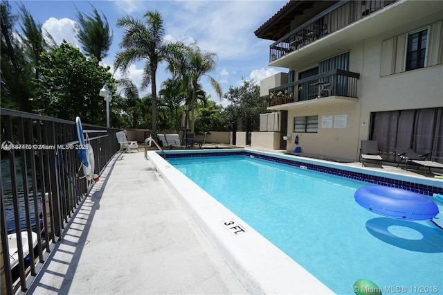 pool featuring a patio area