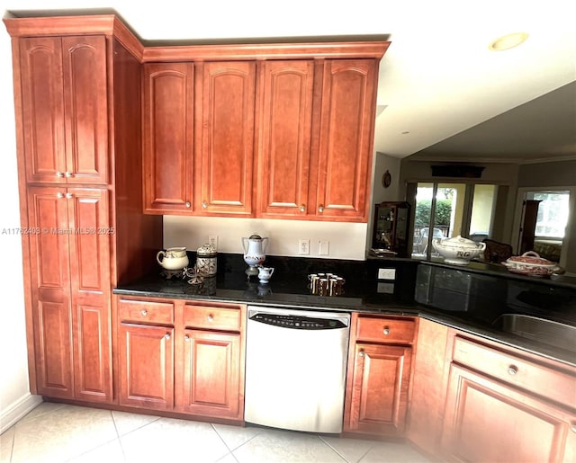 16101 Emerald Estates Dr Unit 143, Weston, FL 33331 - kitchen featuring dishwashing machine, light tile patterned flooring, dark stone counters, ornamental molding, and a sink