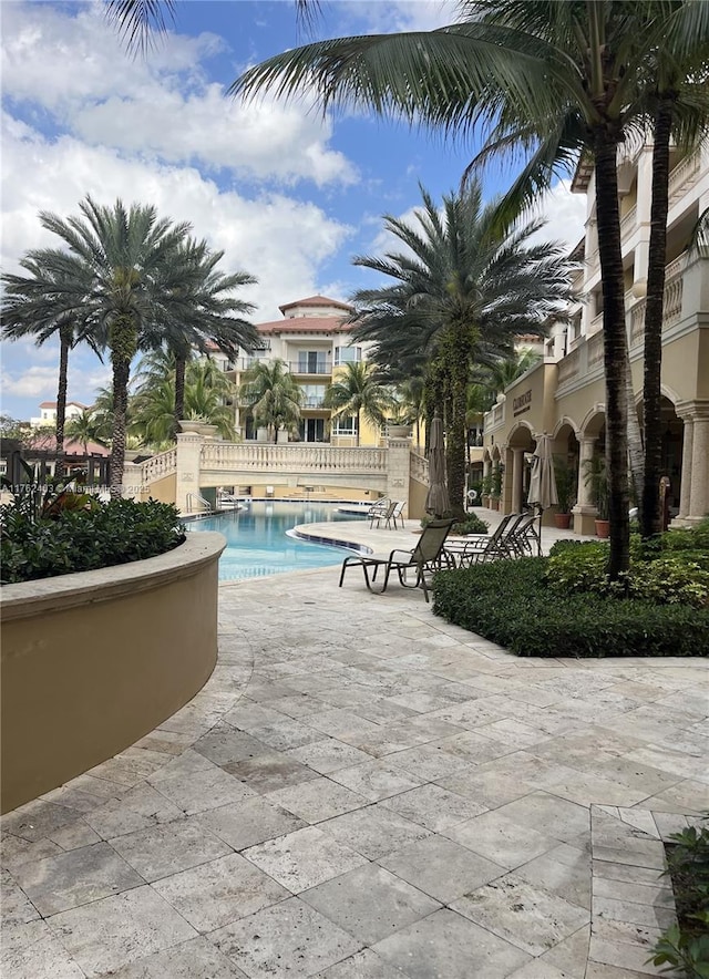16101 Emerald Estates Dr Unit 143, Weston, FL 33331 - community pool featuring a patio