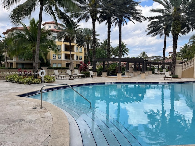 16101 Emerald Estates Dr Unit 143, Weston, FL 33331 - community pool with a pergola and a patio area