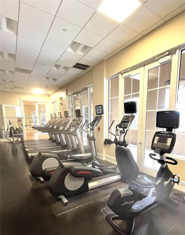 16101 Emerald Estates Dr Unit 143, Weston, FL 33331 - gym featuring french doors, plenty of natural light, and a drop ceiling