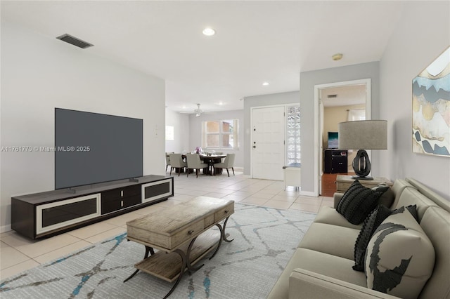 tiled living area with recessed lighting, visible vents, and baseboards