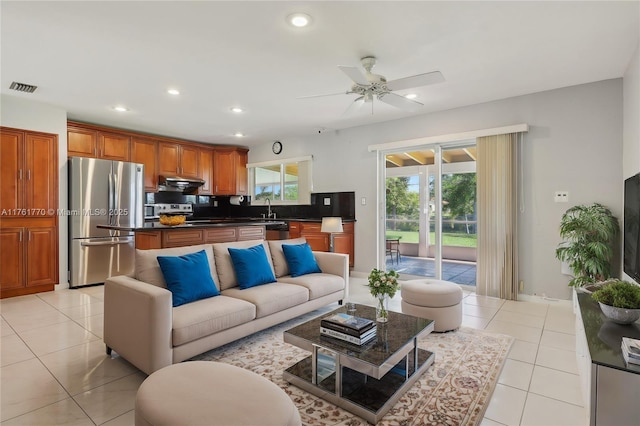 living room featuring light tile patterned floors, visible vents, recessed lighting, and ceiling fan