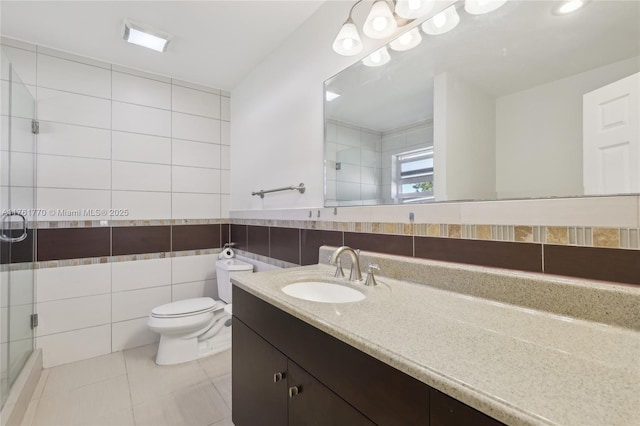 bathroom with toilet, tile walls, a shower stall, and tile patterned flooring