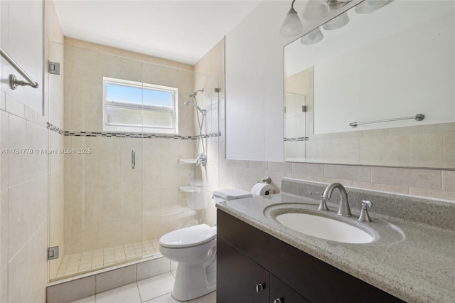 full bathroom featuring toilet, tile walls, a shower stall, decorative backsplash, and vanity