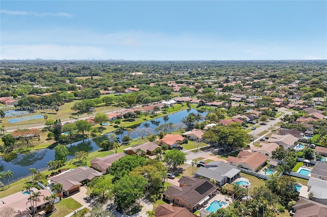 bird's eye view with a residential view and a water view