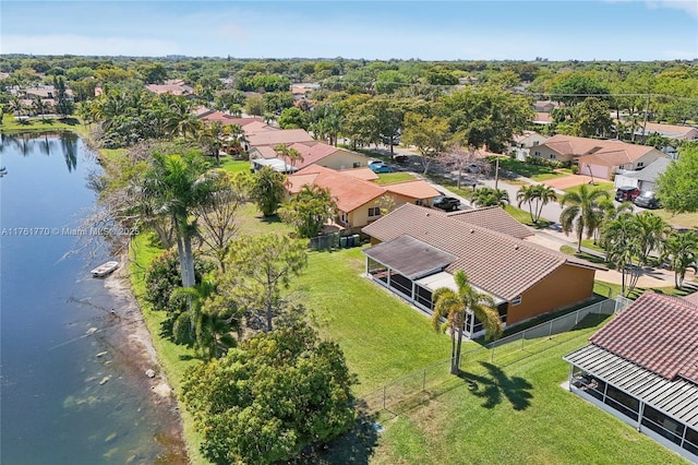 drone / aerial view featuring a residential view and a water view