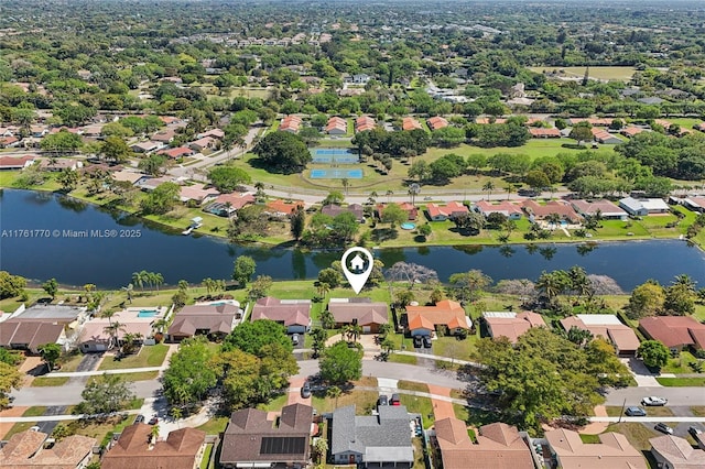 bird's eye view featuring a residential view and a water view