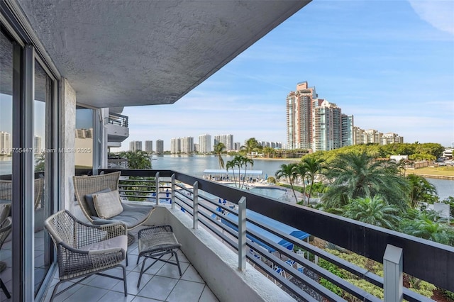 balcony with a view of city and a water view