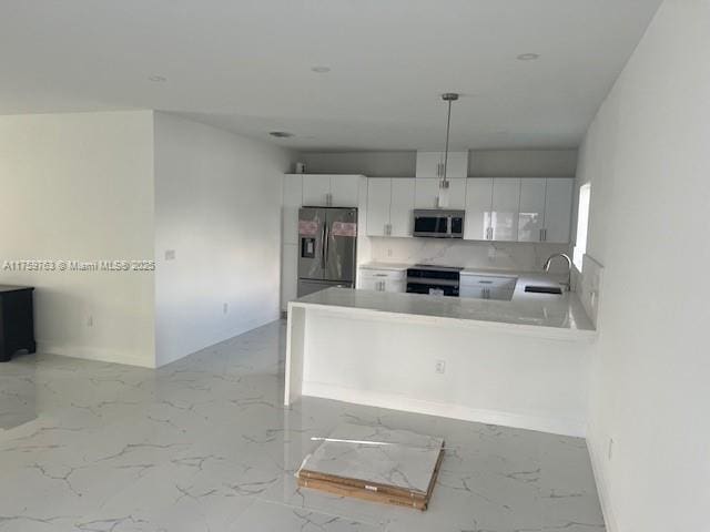 kitchen featuring decorative backsplash, stainless steel appliances, marble finish floor, white cabinetry, and a sink