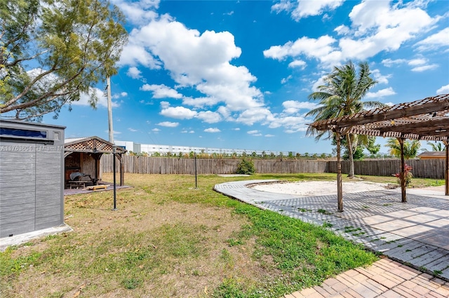 view of yard with a fenced backyard, a pergola, and a patio