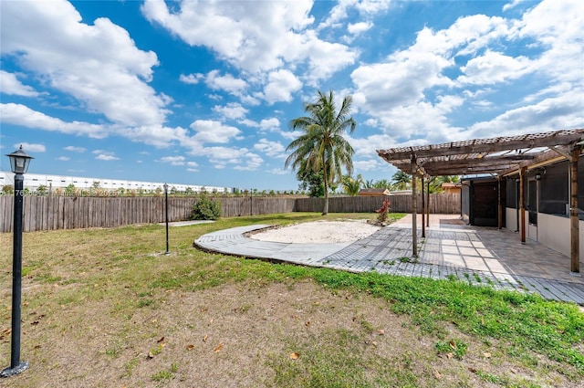 view of yard featuring a patio area, a pergola, and a fenced backyard