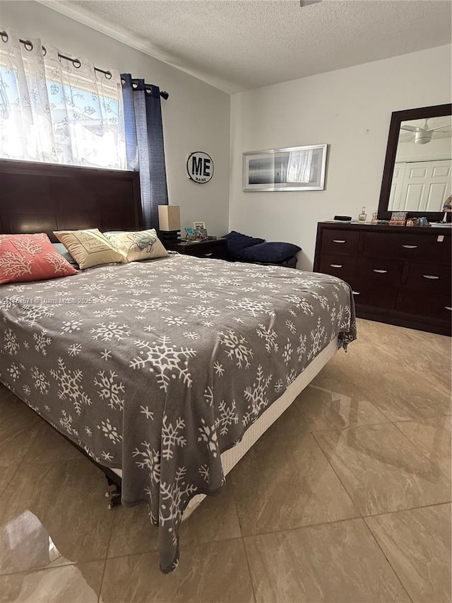 bedroom with a textured ceiling and lofted ceiling