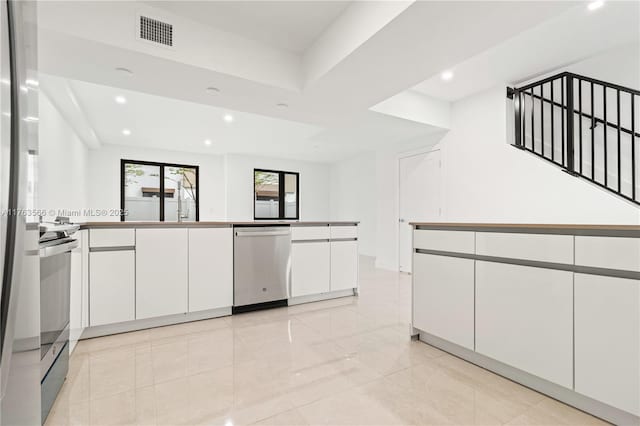 kitchen featuring white cabinetry, recessed lighting, visible vents, and appliances with stainless steel finishes